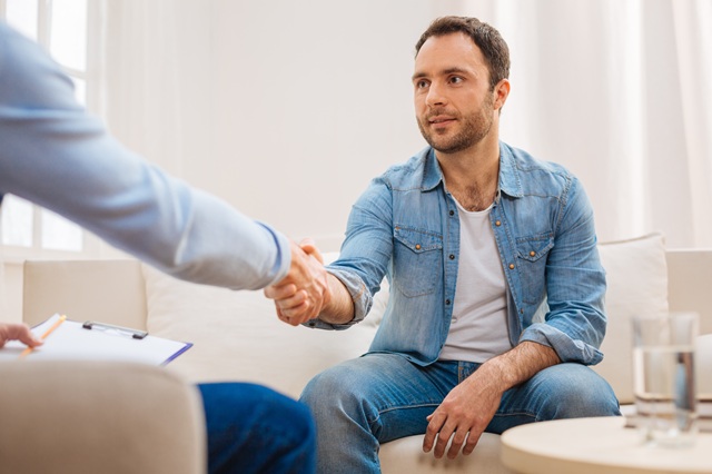 Pleasant good looking man visiting psychologist